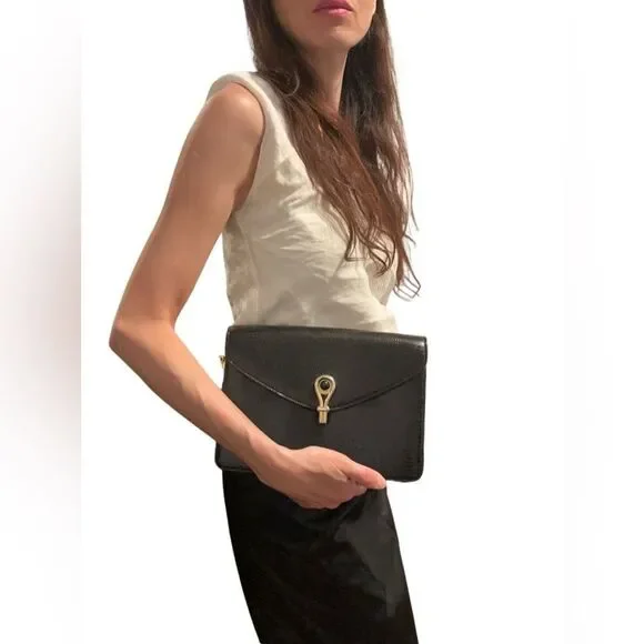Gucci Black and Gold Leather Clutch